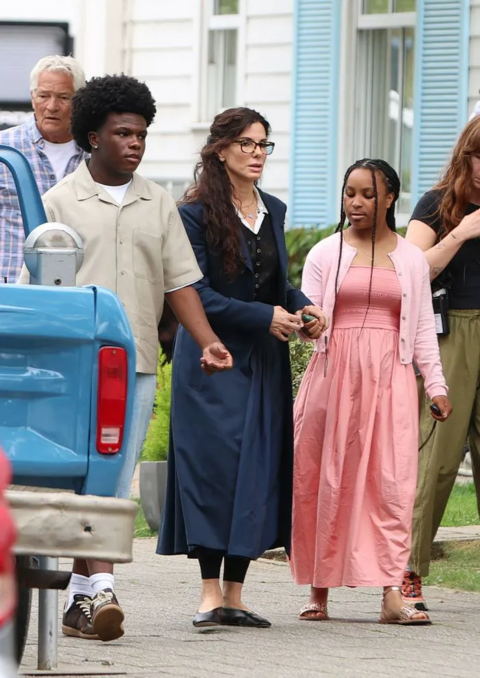 "Sandra Bullock with her children during filming for Practical Magic 2"