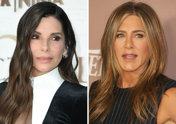 Sandra Bullock and Jennifer Aniston posing together at an event.