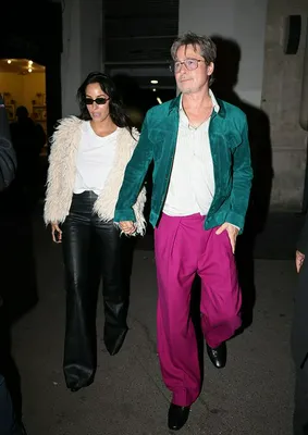 Brad Pitt and Ines de Ramon enjoying a live concert together.
