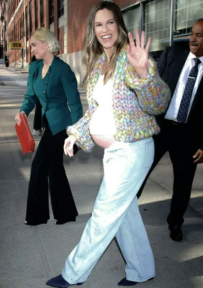 "Hilary Swank pregnant in a rainbow cardigan"