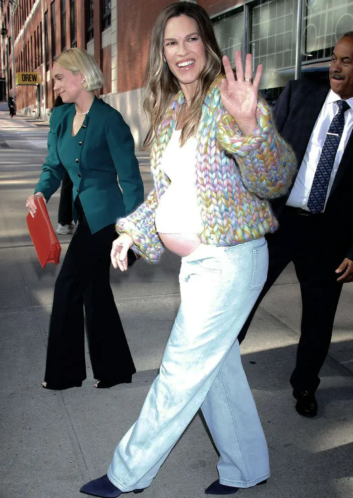 "Hilary Swank pregnant in a rainbow cardigan"