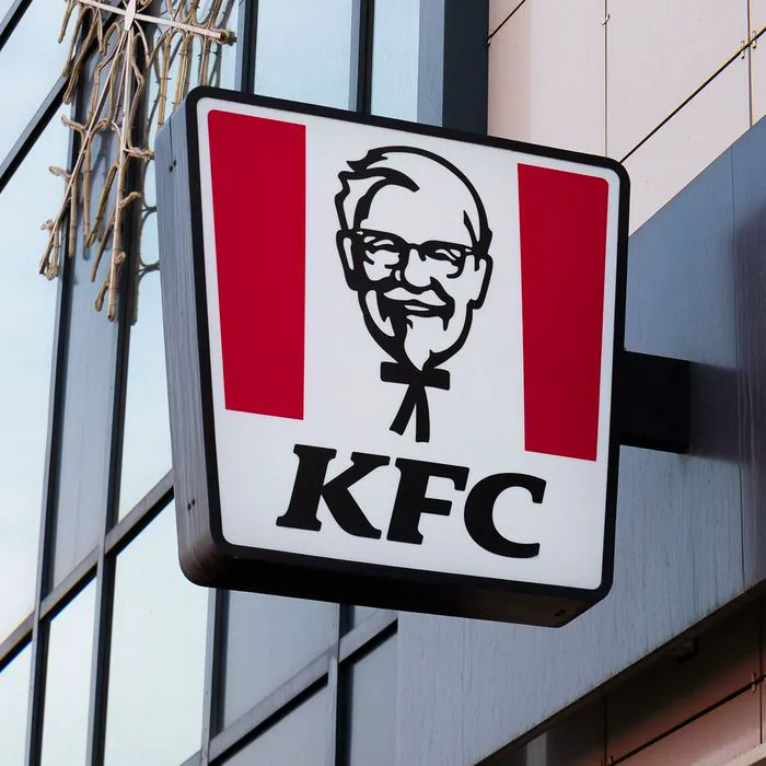 KFC store sign featuring iconic logo and branding.