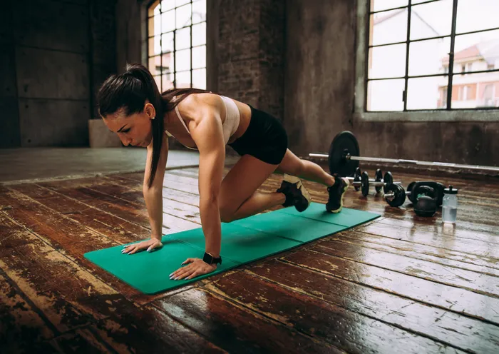 Woman walking on a treadmill for cardio exercise