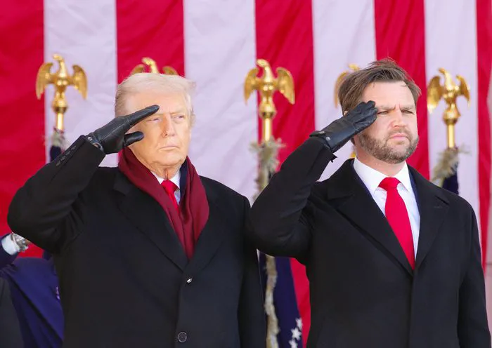 "Vice President JD Vance saluting a color guard at a veterans event"