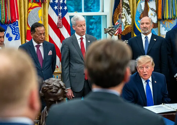 "Donald Trump speaking to reporters in the Oval Office"
