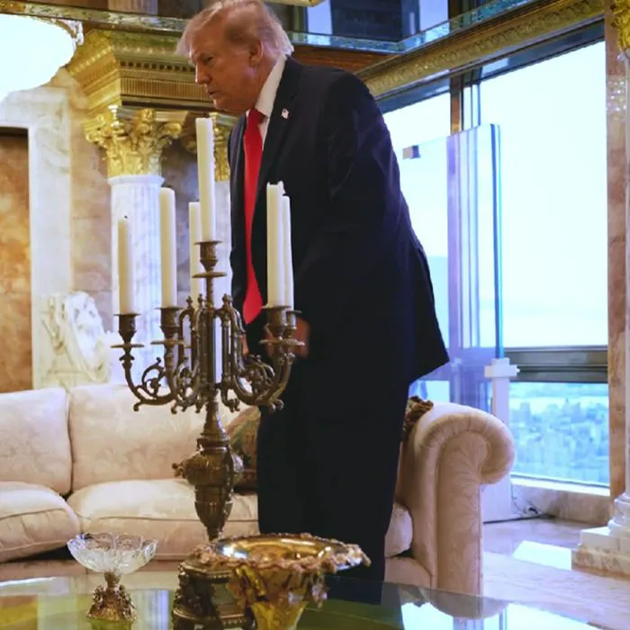 Donald Trump sitting on a pillow at Trump Tower