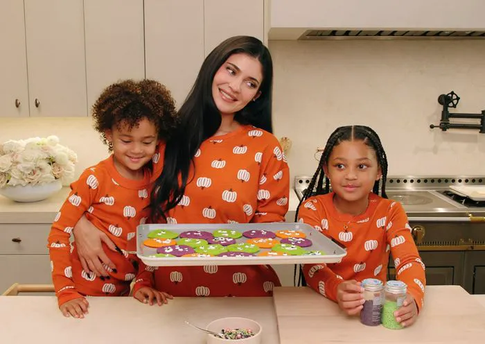 "Kylie Jenner and her kids in matching Halloween pajamas making cookies"