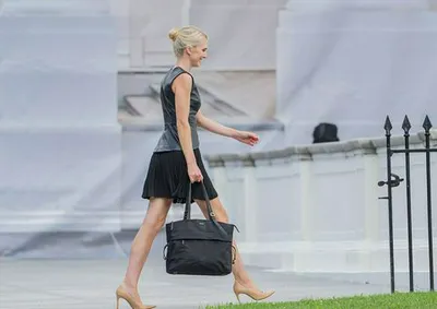 "Natalie Harp in a black dress at an event"